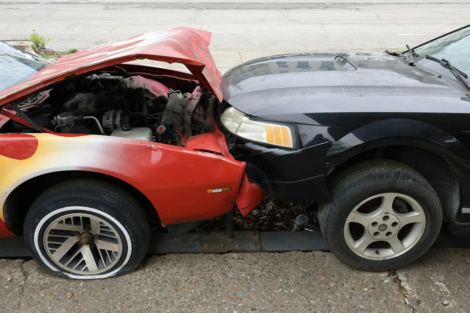 Two cars after a frontal collision on a city street